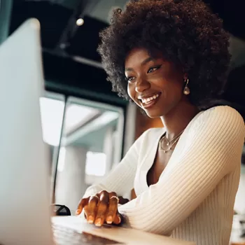 young african american woman reviewing finances on computer